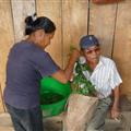 Shaman and wife preparing herb bath