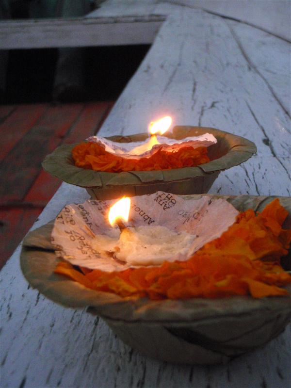 Lighting our prayers and letting them float on the great Ganje