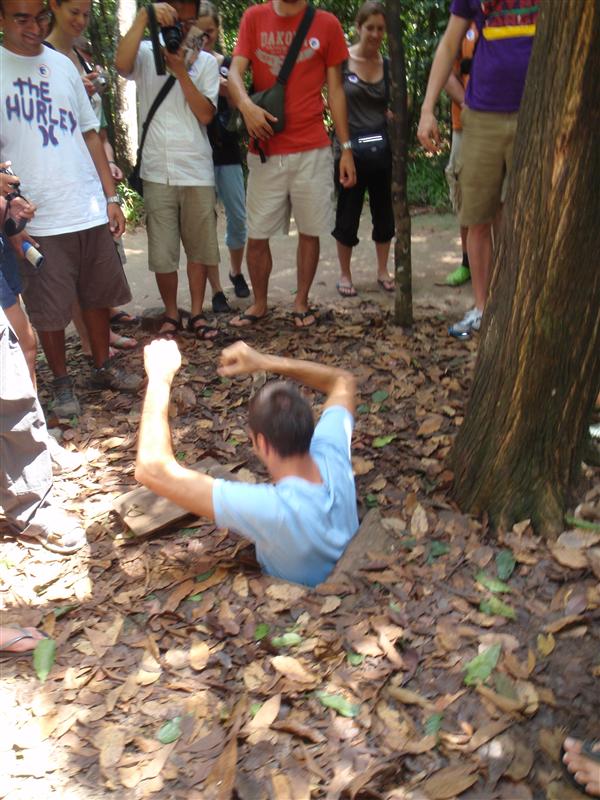 Chad trying to fit into one of the Cu Chi tunnels outside of Saigon