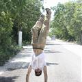 Ryan doing a handstand down the long long hot hot road
