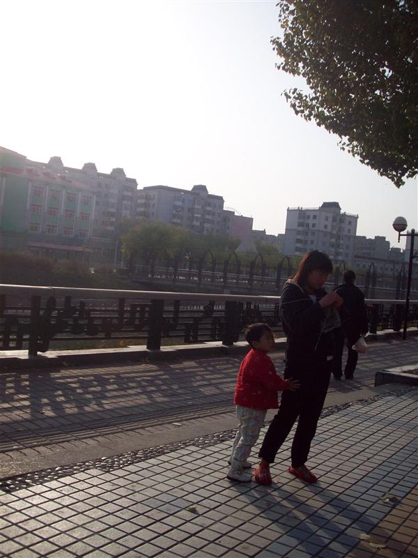 Woman knitted with kids climbing all over her