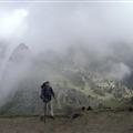 Standing before misty Machu Picchu
